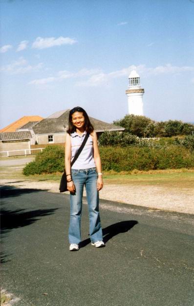 Smiling Arty with lighthouse in background.